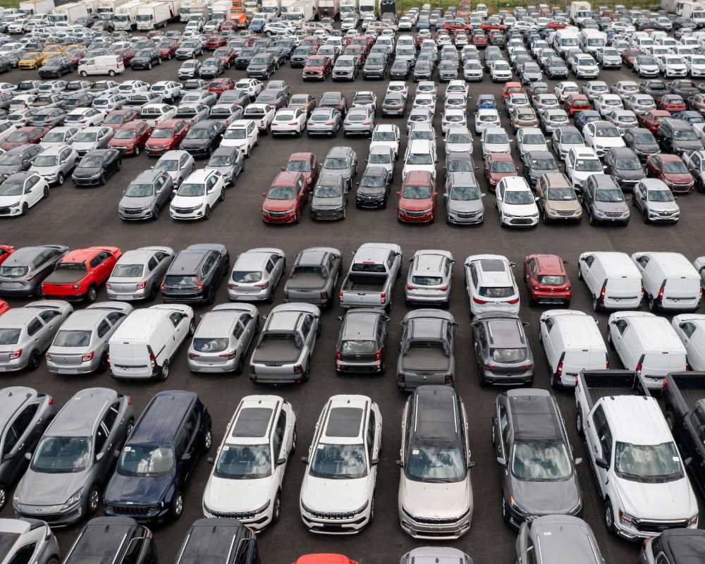 Japanese car auction with vehicles being inspected for export eligibility
