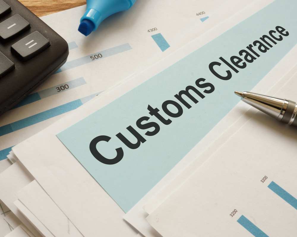 Customs officials inspecting imported Japanese vehicle for compliance